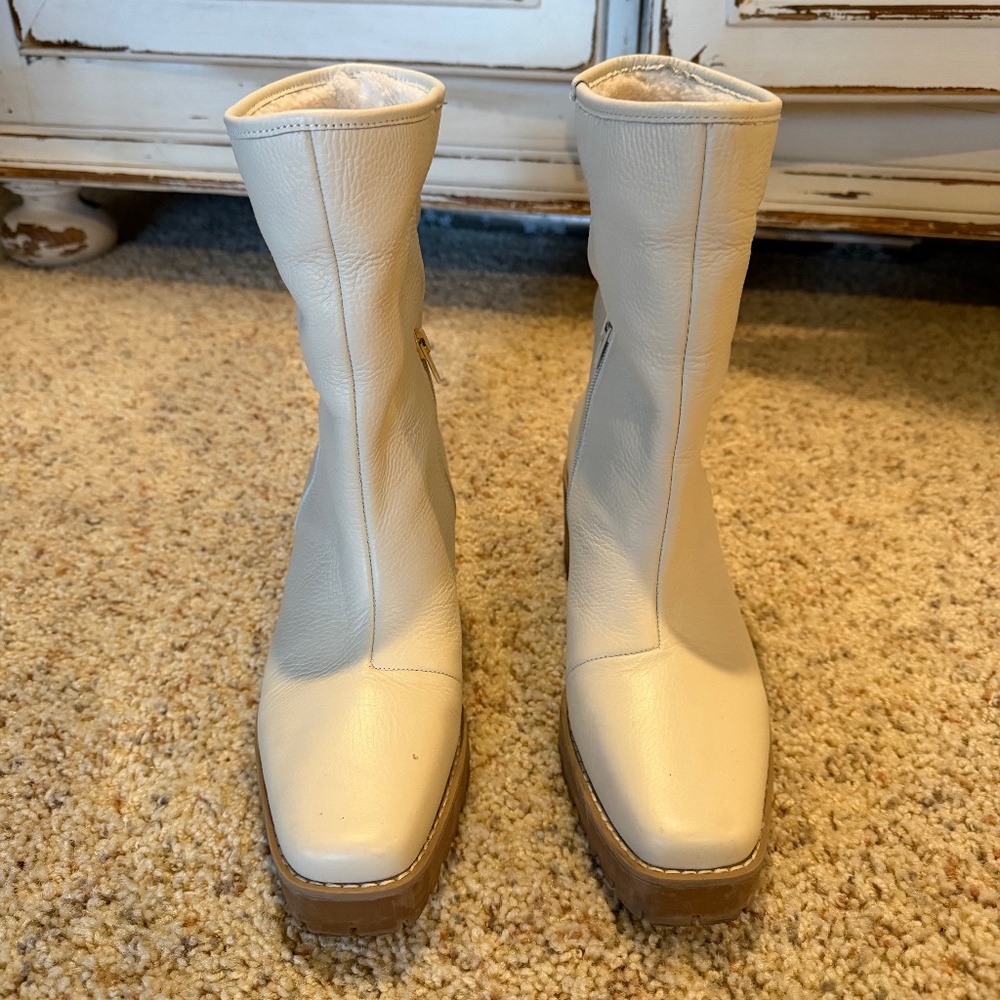 Woman’s cream boots with 2.5” heel size 9